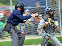 FBOA member Dale Yoder umpires a state tournament baseball game.