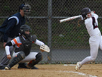 FBOA member Roger Meier umpires a softball game on a cold Saturday morning.