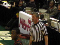 FBOA member Bruce Arter officiates a 2010 Class B Boys Semi-Final basketball game.