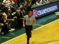 FBOA member Bruce Arter officiates a 2010 Class B Boys Semi-Final basketball game.