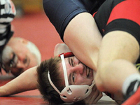 FBOA member Jim McCloughan officiates wrestling.